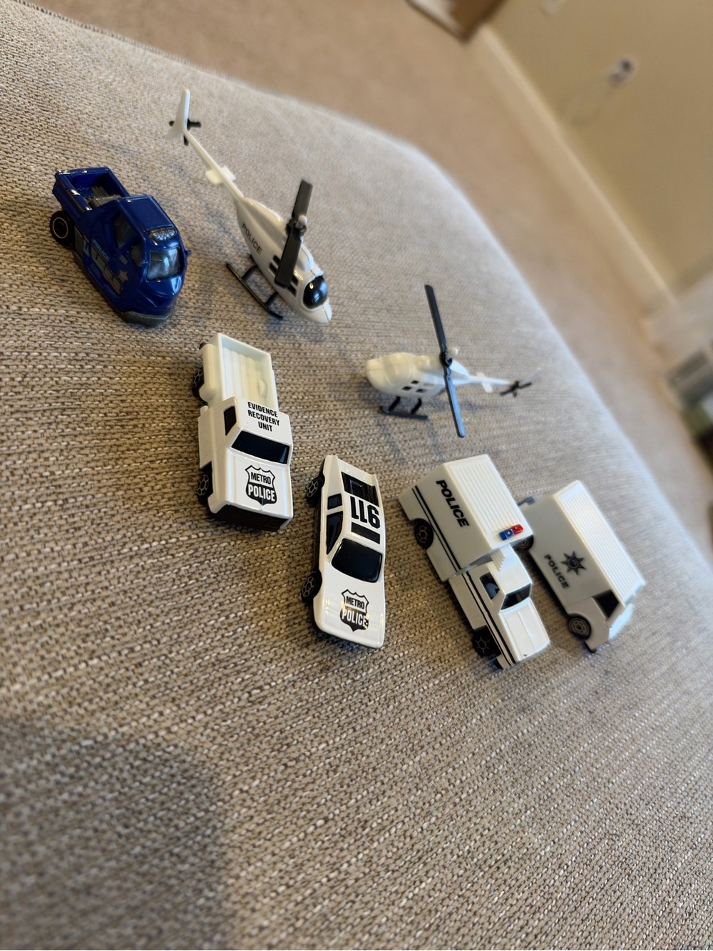 Bundle of small police cars and helicopters